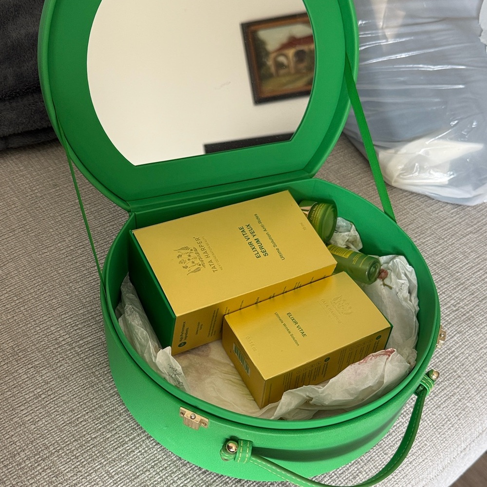 Tata Harper Green Cosmetic Case with Yellow Elixir Box